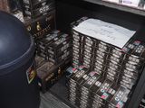 boxes of cigarettes are stacked on top of each other in a store