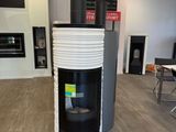 a black and white stove in the middle of a room