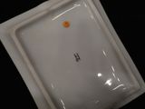 a white plate with a smiley face on it