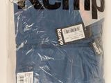 an image of a bag of blue underwear sitting on top of a white table