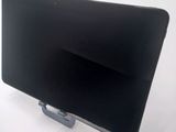 a black tablet computer sitting on top of a white table