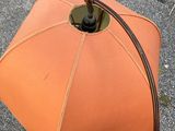 a person that is holding an umbrella in their hand