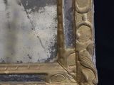 a picture of a gold picture frame on a black background