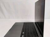 a laptop computer sitting on top of a white table