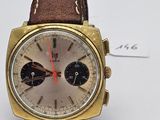 an image of a watch with a brown leather strap on a white surface