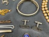 many different types of jewelry on the table