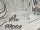 a display case with a lot of jewelry on it