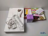 a white box with various items in it on a table