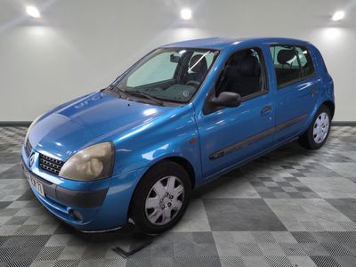 a picture of a blue car parked in a garage