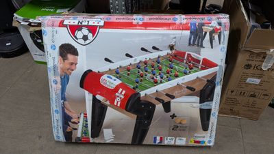 a box that has a foosball table inside of it