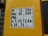a close up of a sign on a yellow machine