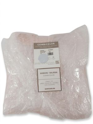 un sac de sable posé sur une table blanche