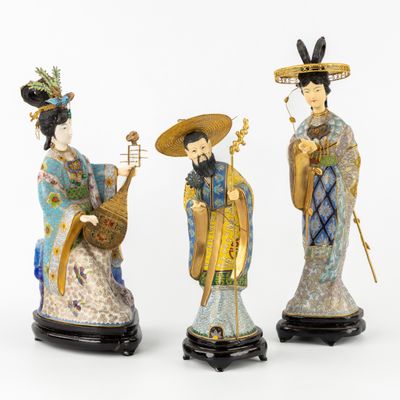 three asian figurines of women with hats and holding musical instruments