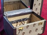 an open suitcase sitting on top of a red table