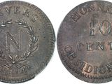 a close up of a coin with a wreath on it
