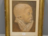 tableau représentant un bébé dans un cadre doré sur fond blanc