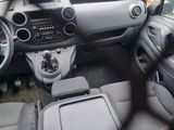 the interior of a car with a steering wheel, dashboard, and dashboard controls