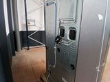 a machine that is sitting on a pallet in a building