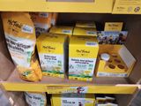 many boxes of food on the shelf in the store