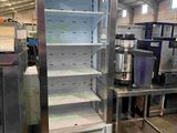 a refrigerator that is sitting in the middle of a room