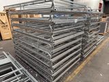 a large pile of metal racks in a warehouse