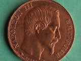 a close up of a coin with a man ' s face on it
