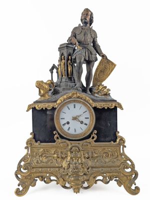 a clock with a statue of a man on top of it