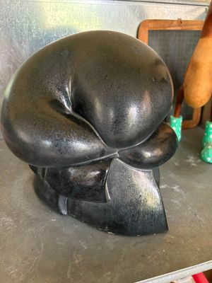 a statue of a dog that is sitting on a counter
