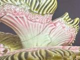 a close up of a vase with a flower inside of it