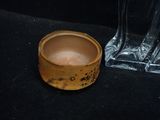 a glass vase and a small bowl on a table