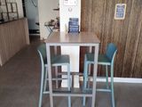 a small table and two chairs in a room
