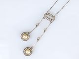 a pair of pearl and diamond pendants