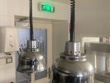 two lights hanging from the ceiling in a kitchen