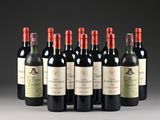 six bottles of red wine lined up in a row