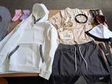a table with a bunch of clothing on it