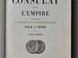 an open book with a picture of a coin on the cover