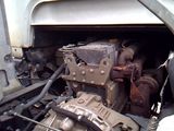 a engine of a truck that is sitting in the back of it ' s truck