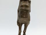 an image of a bronze statue of a woman standing on a base