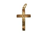a close up of a gold cross on a white background