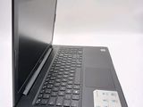 a laptop computer that is sitting on a white surface