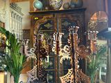 a glass display case with a clock inside of it