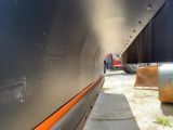 a large boat that is sitting on the side of the road