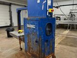 a blue machine that is sitting in a room