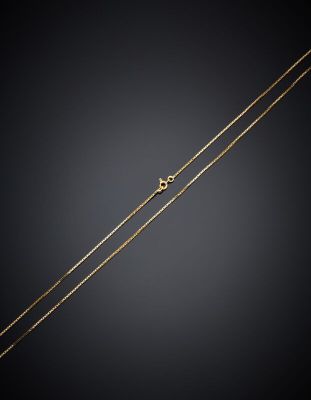 a gold chain with a heart charm on it