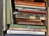 a box full of books sitting on the floor