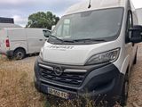 a white van that is parked on the side of the road