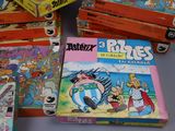 several children ' s books stacked on top of each other on a table