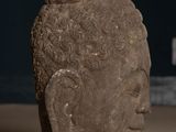 statue of a head of a man with a beard on a table