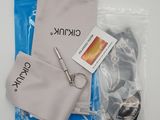 a pair of scissors and a pouch on a table