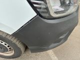 a close up of the front of a car with a dent in it